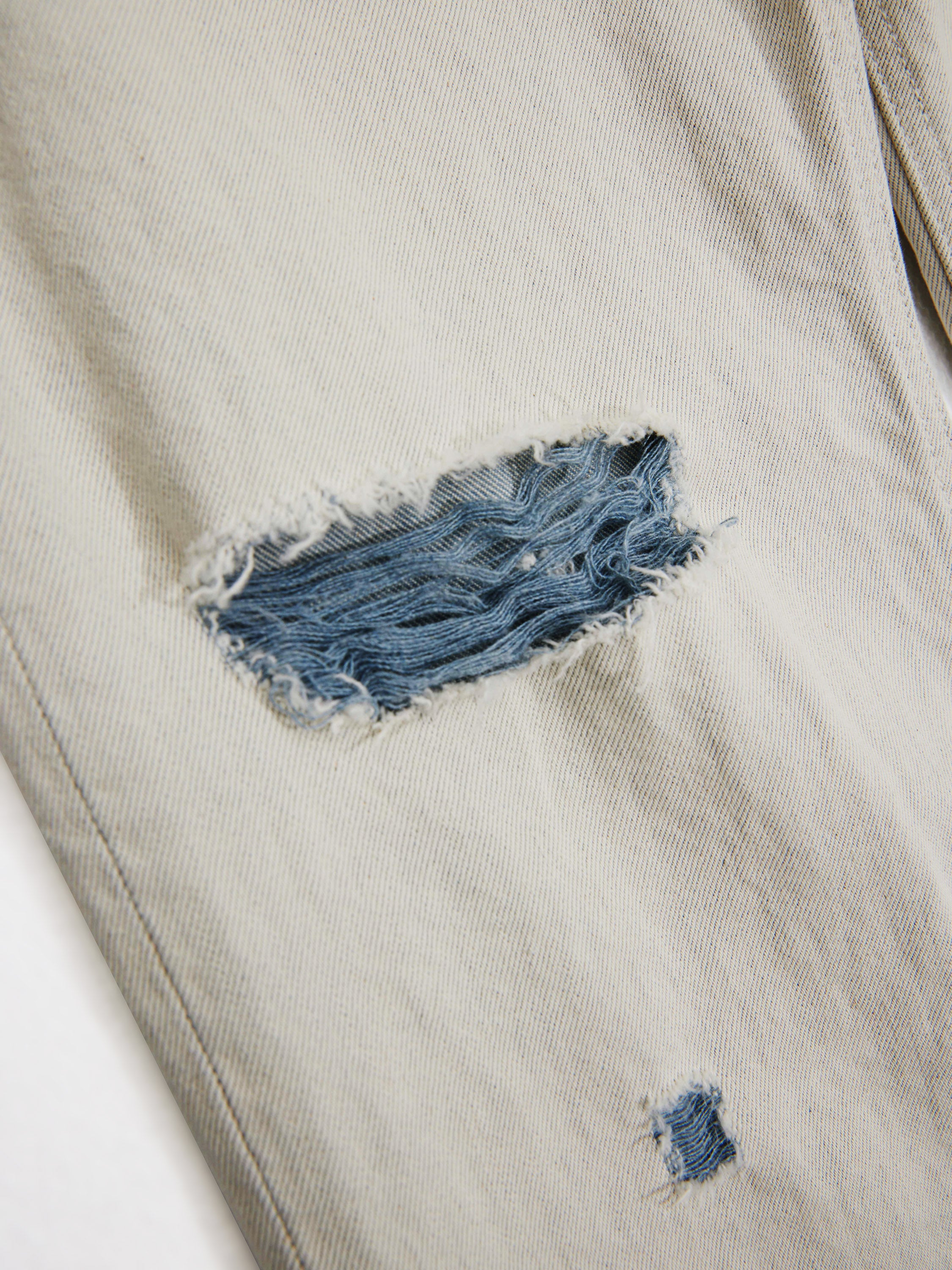 Distressed Flared Jeans in Off-White